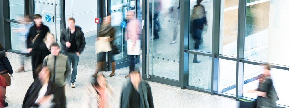 Blurred image of people entering a building