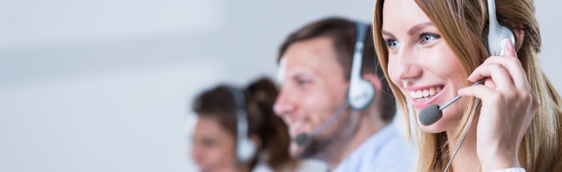 Woman in call centre with headphones
